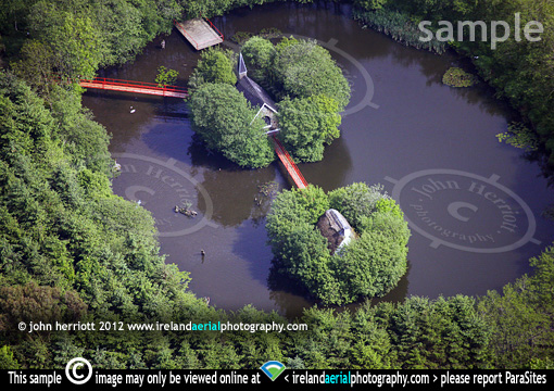 garden pond with church and cottage