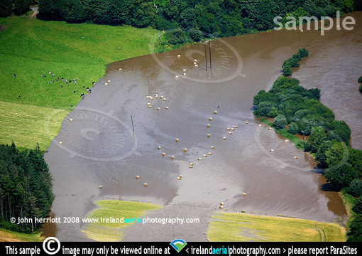 straw bales floating in Blackwater flood